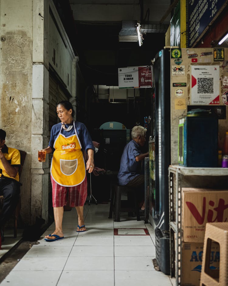 People In A Market Place With Food 