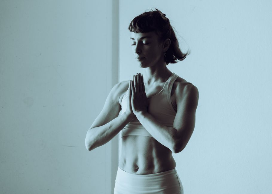 A serene woman meditating and practicing yoga indoors, conveys calm and mindfulness. A serene woman meditating and practicing yoga indoors, conveys calm and mindfulness.