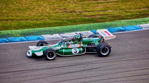 Green Racing Car on the Race Track 