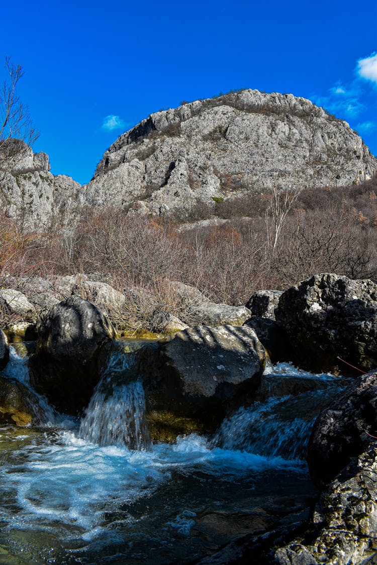 Small Alpine Waterfall In Autumn