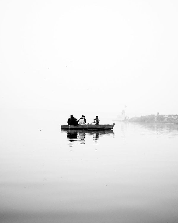 A People Riding a Boat on Water · Free Stock Photo