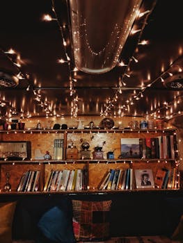 A warm, vintage-inspired bookshelf setup with string lights, evoking a nostalgic and cozy atmosphere.