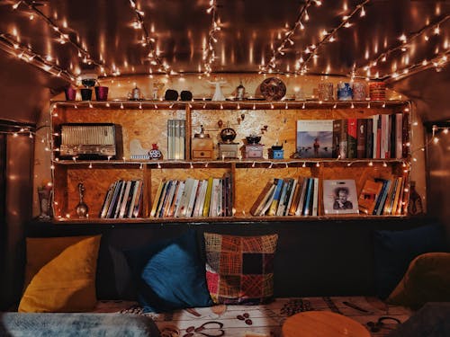 Cosy Interior with Bookshelf and Fairy Lights 