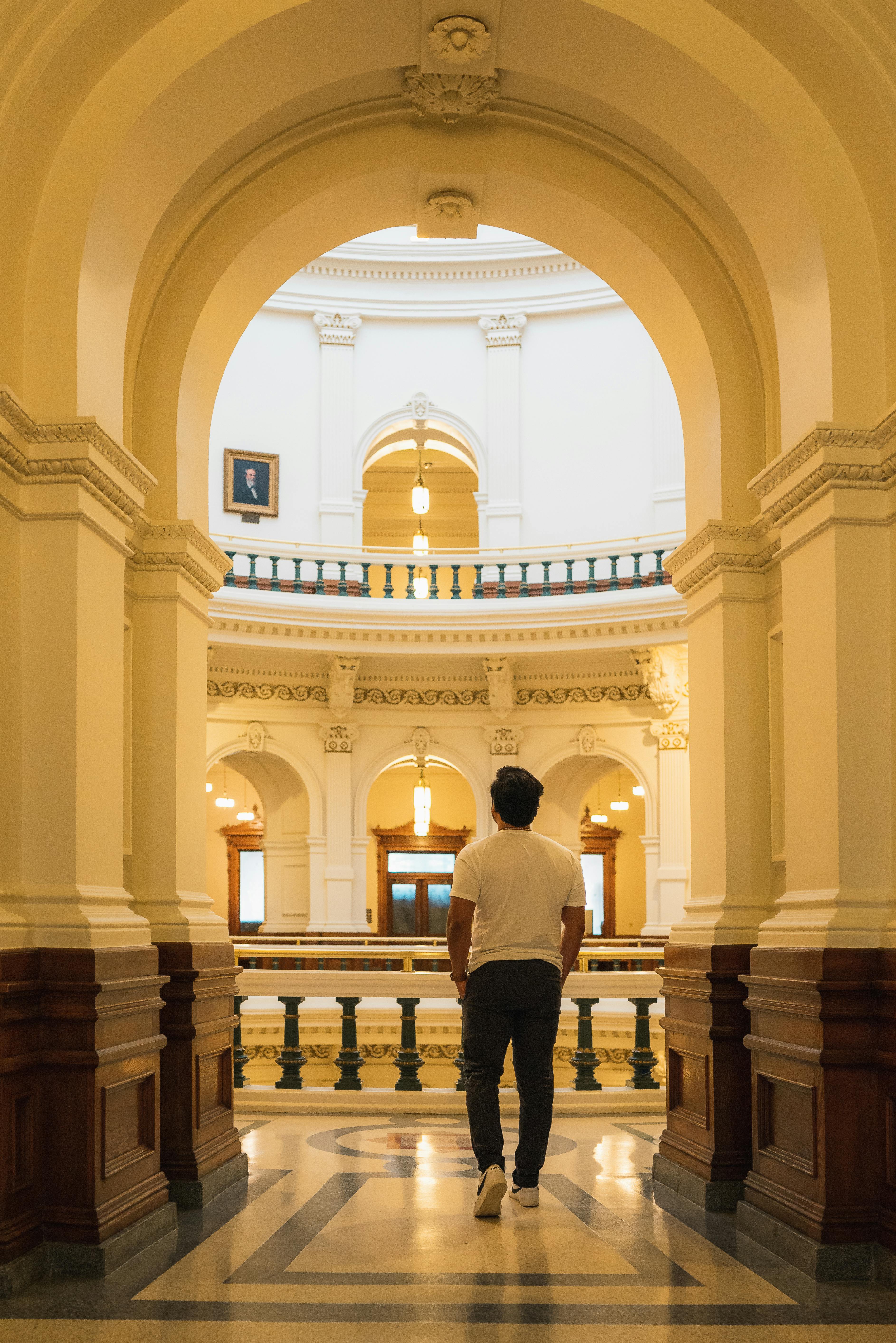 man walking at texas capitol