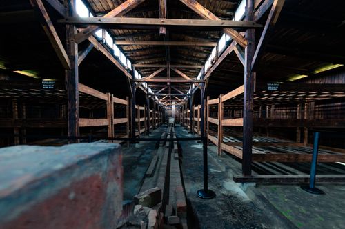 Free Spacious abandoned corridor with wooden beams and structure inside historic building. Stock Photo