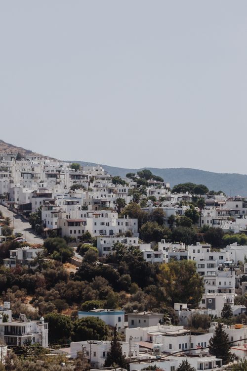 Free Scenic aerial view of Bodrum, Turkey, showcasing traditional white architecture and lush greenery. Stock Photo
