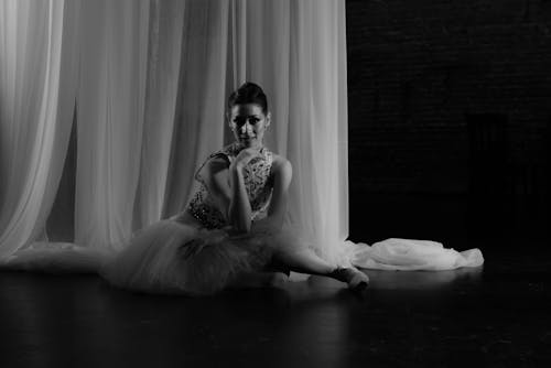 Beautiful Ballerina Sitting on the Floor