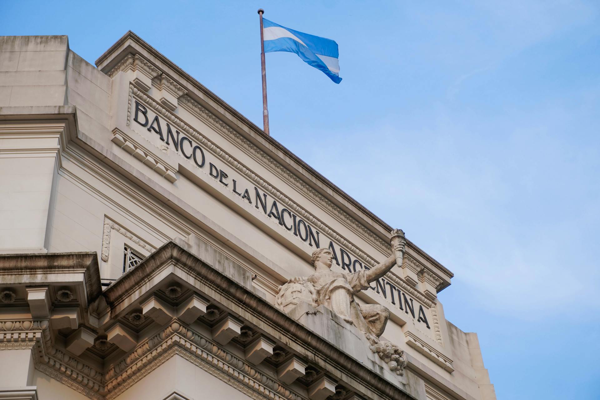 Low angle view of Banco de la Nación Argentina with flag in Concordia, Entre Rios.