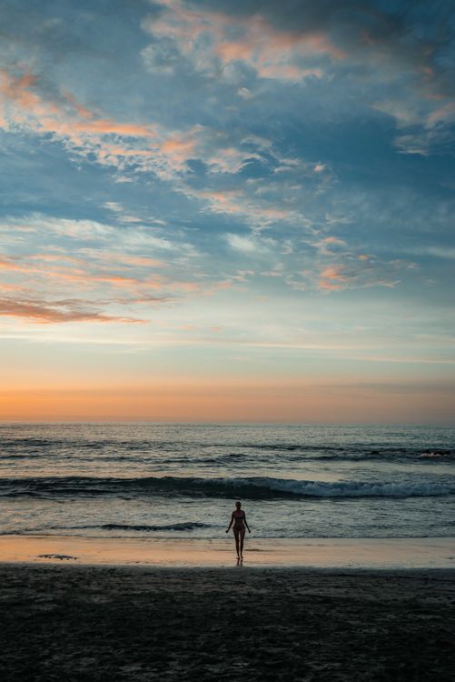 Woman at the Beach during Sunset · Free Stock Photo
