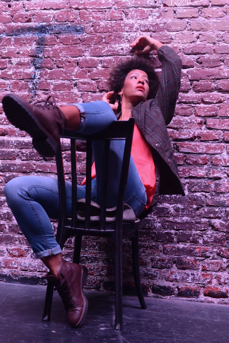 Woman Sitting On A Chair Backwards 