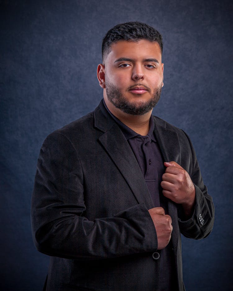 Stylish Man In Suit Posing In Studio