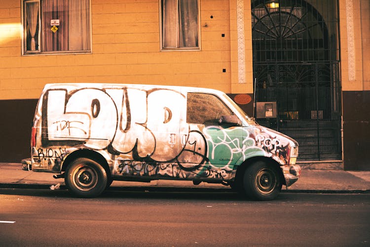 White And Green Van On Road