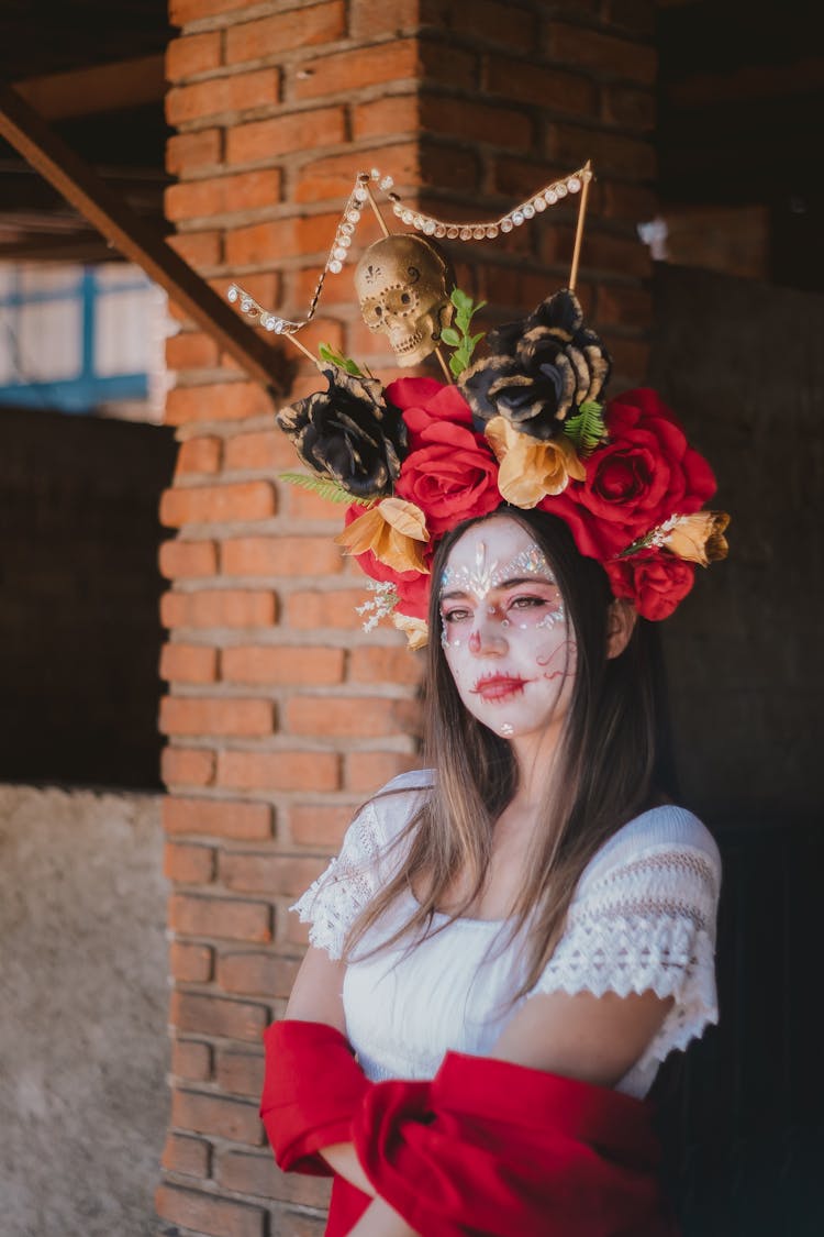 Woman In Traditional Clothing And Wreath With Skull