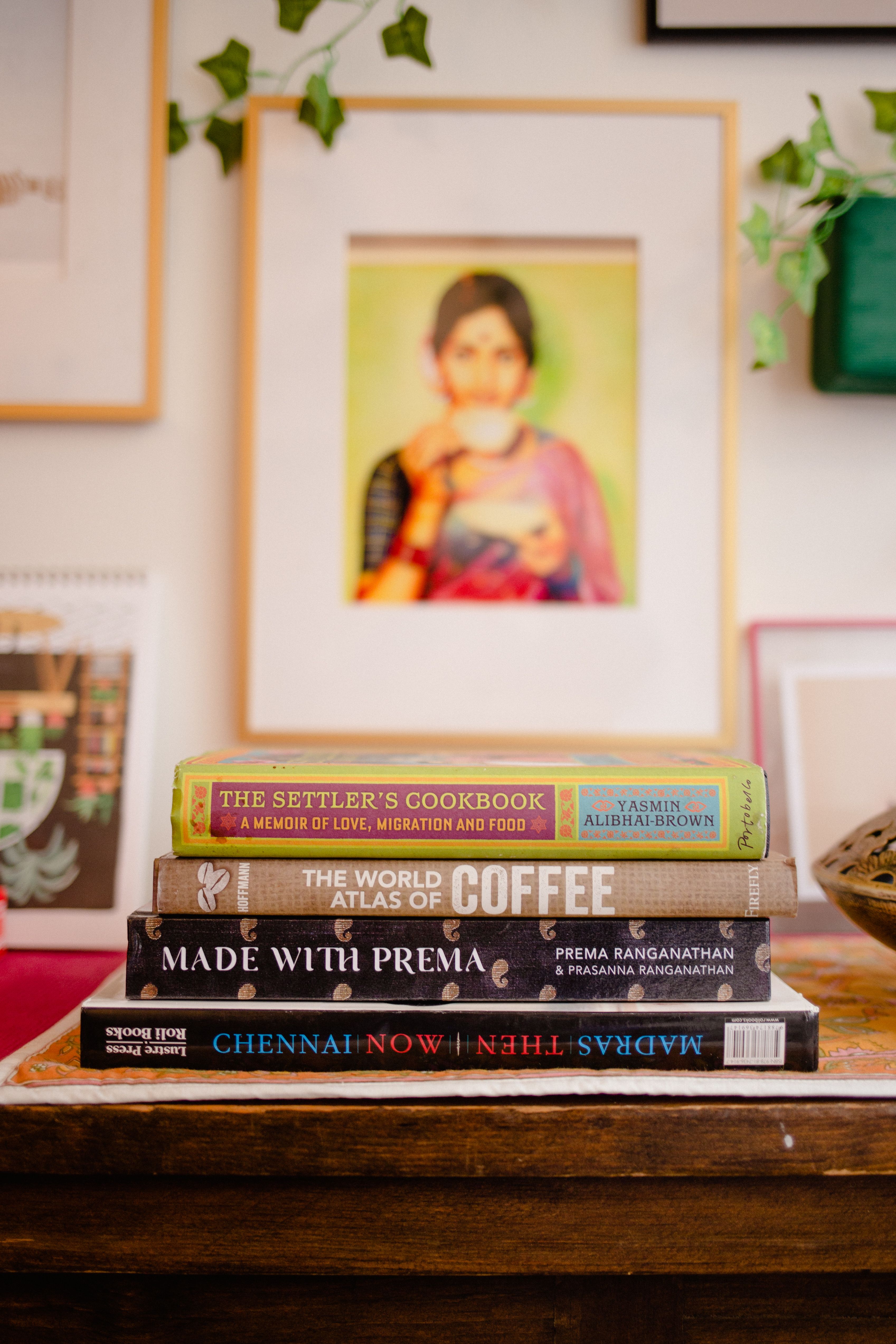 A vibrant stack of books including titles about cooking, coffee, and Chennai history.