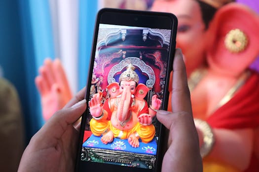 Close-up of a Ganesha idol captured through a smartphone in Khatwadi, India.