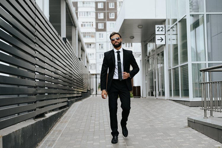 Man In Black Suit Walking