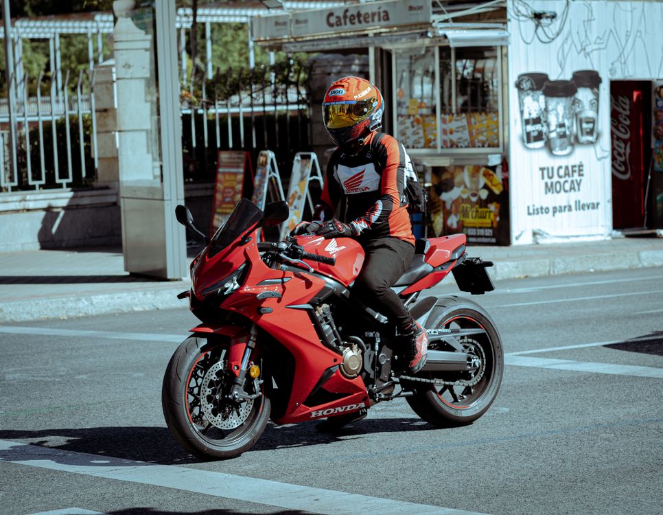 A Man Riding Red Motorbike · Free Stock Photo