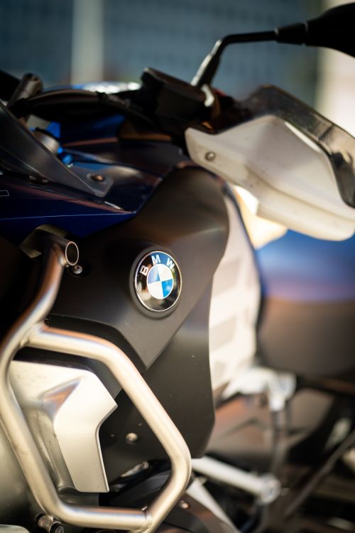 Free Vertical shot featuring a close-up of a motorcycle's emblem, highlighting its luxury brand appeal. Stock Photo