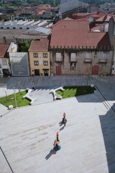 Scenic aerial shot of Jardim de Santa Barbara featuring urban architecture and tourists.