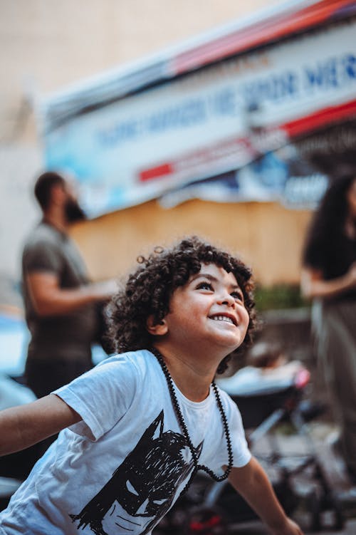 Boy Wearing a White Crew Neck Shirt