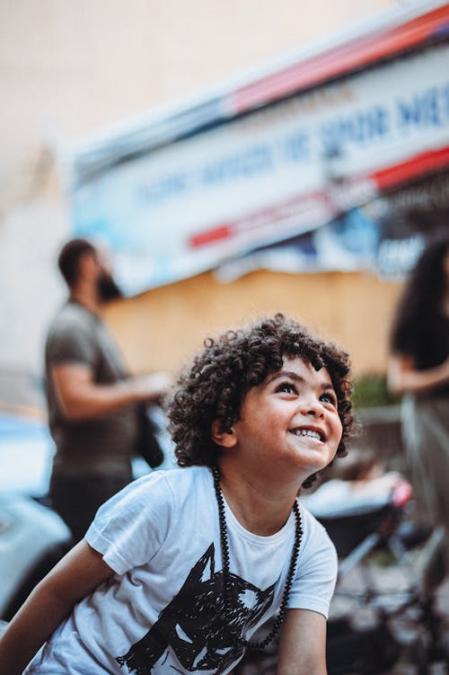 Smiling Boy Wearing a White Shirt