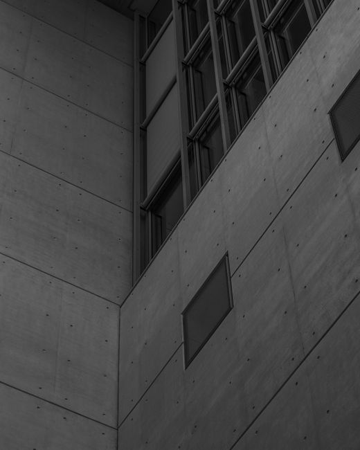 Sleek and modern concrete facade showcasing geometric patterns and minimalist design.