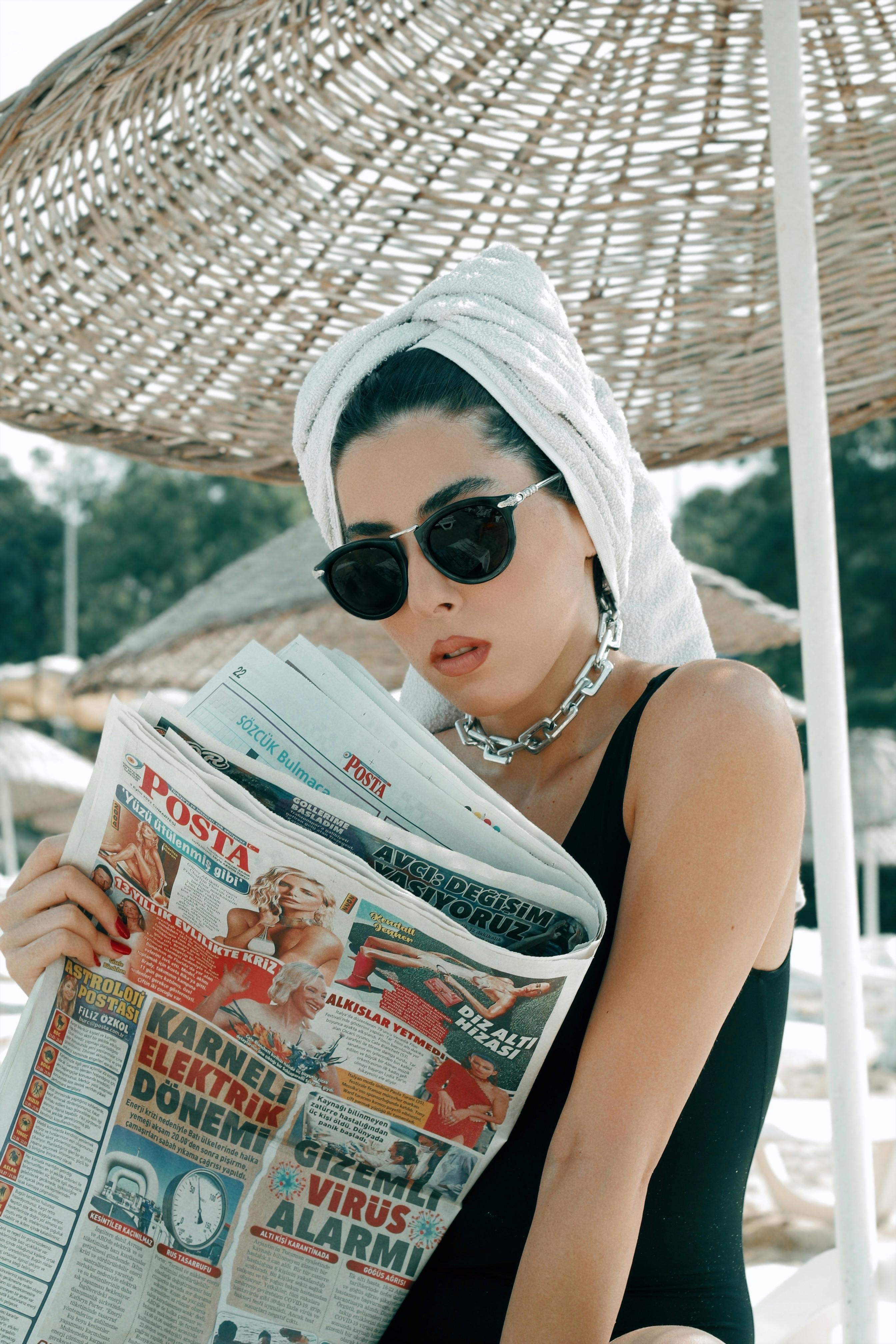 A Hijab Woman In Stylish Sunglasses And An Elegant French Outfit, Walking  Through The City At Sunset, Carrying A Bouquet, Bread, And Newspaper,  Radiating A Sense Of Cultural Charm And Serenity Stock