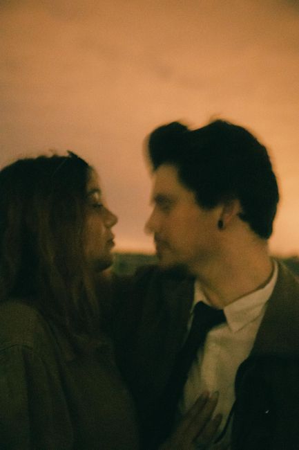 An artistic, blurred image of a couple embracing, evoking romance and intimate connection.
