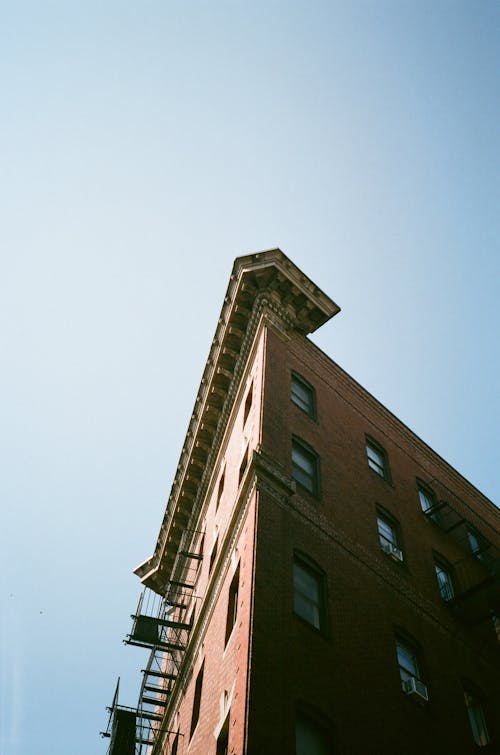 A Low Angle Shot of a Concrete Building Under Blue Sky