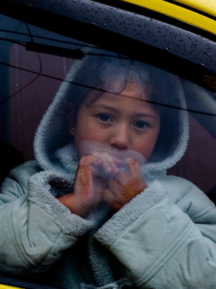 A Girl Wearing A Hoodie Inside A Car