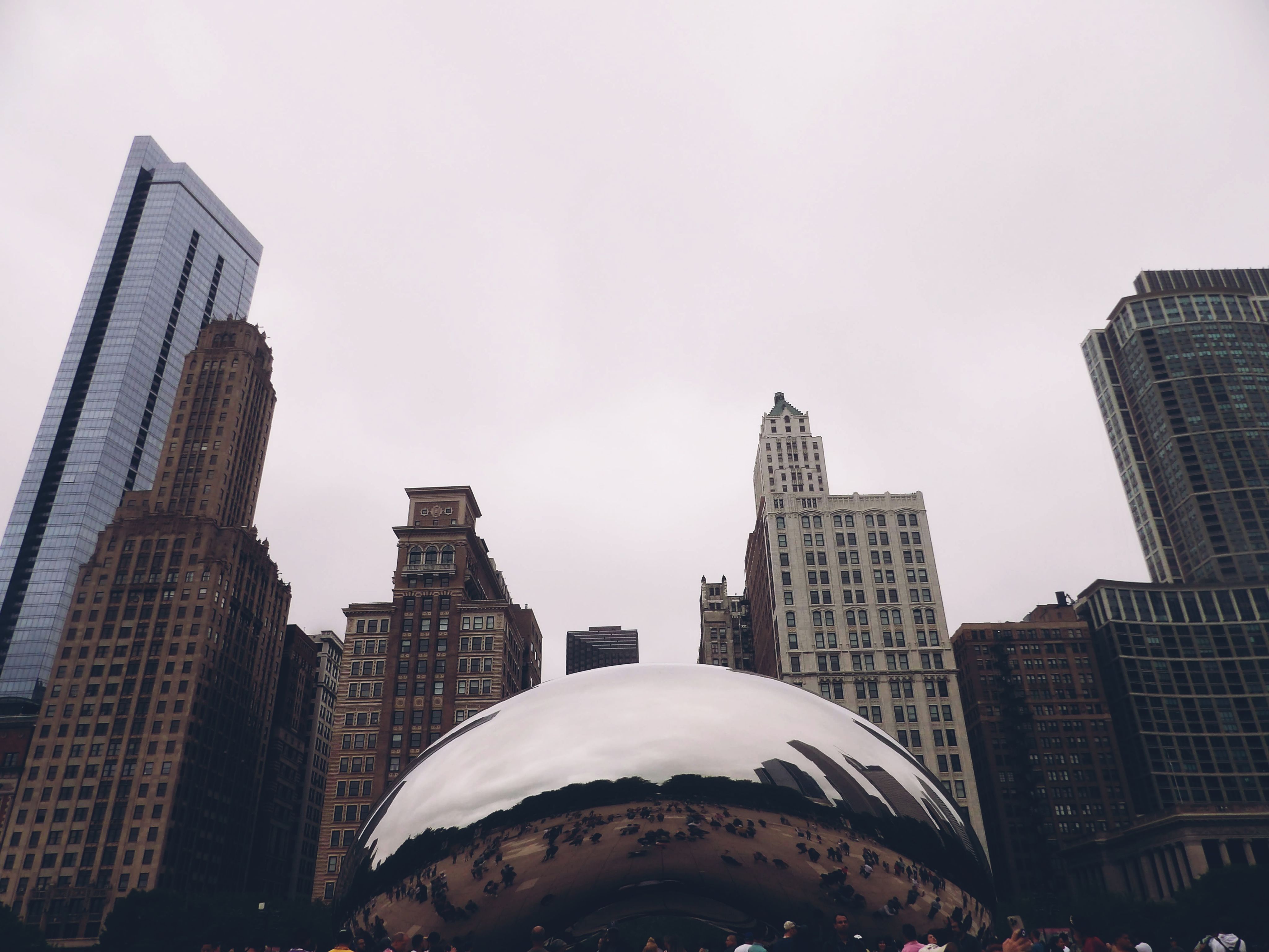 Brown and White High Rise Buildings Under White Sky · Free Stock Photo