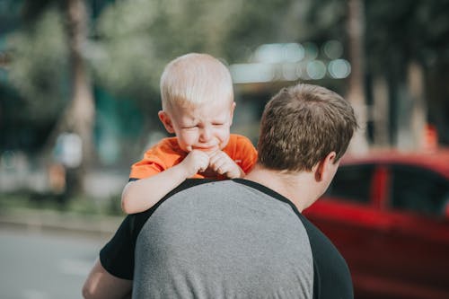 Free Man Carrying Child Stock Photo