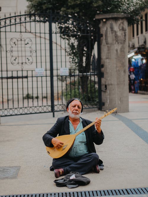 Musician Playing Mandolin on City Sidewalk