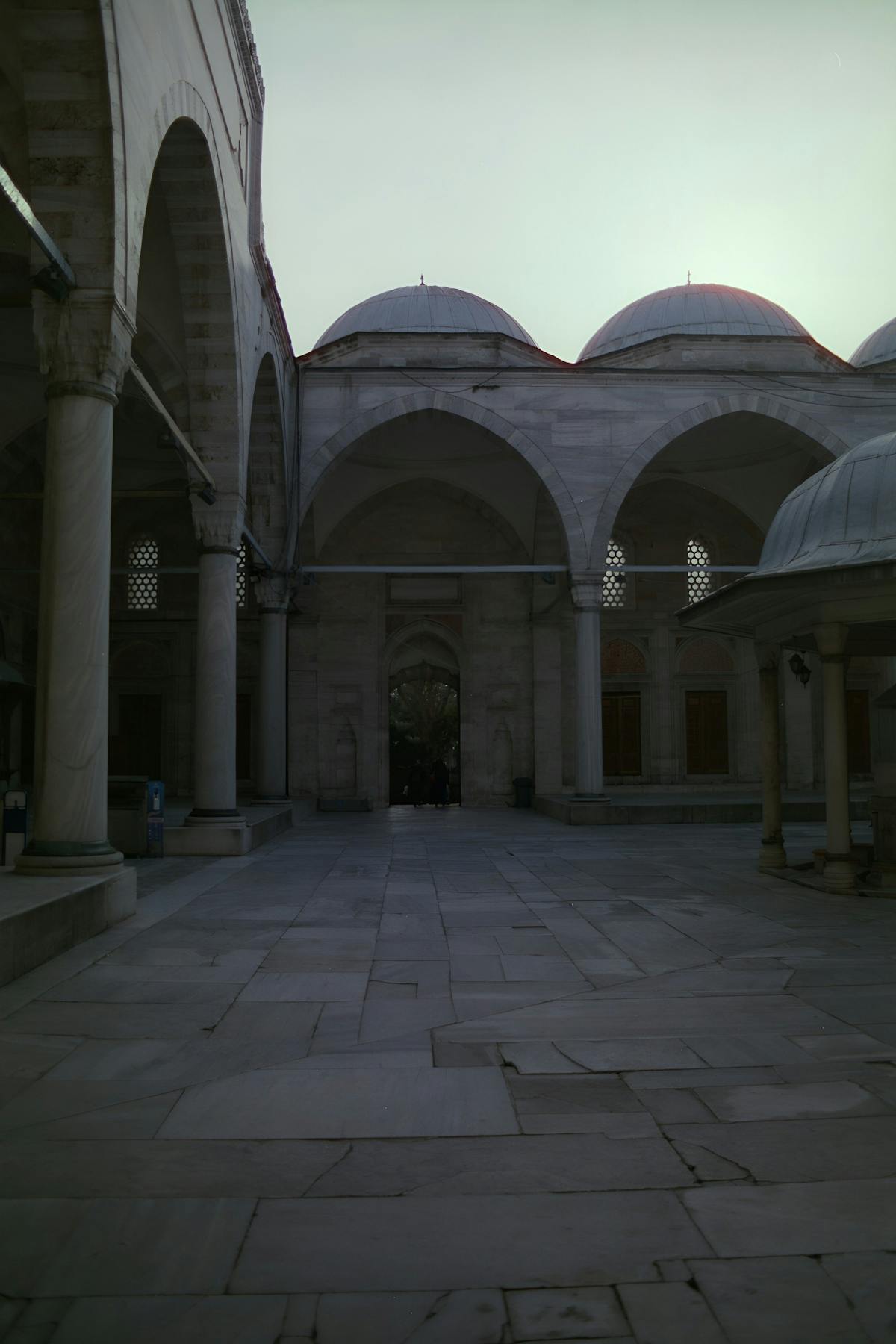 Multiple social media notifications appearing around a smartphone on a desk