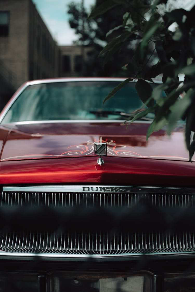 Hood Of A Red Classic Car 