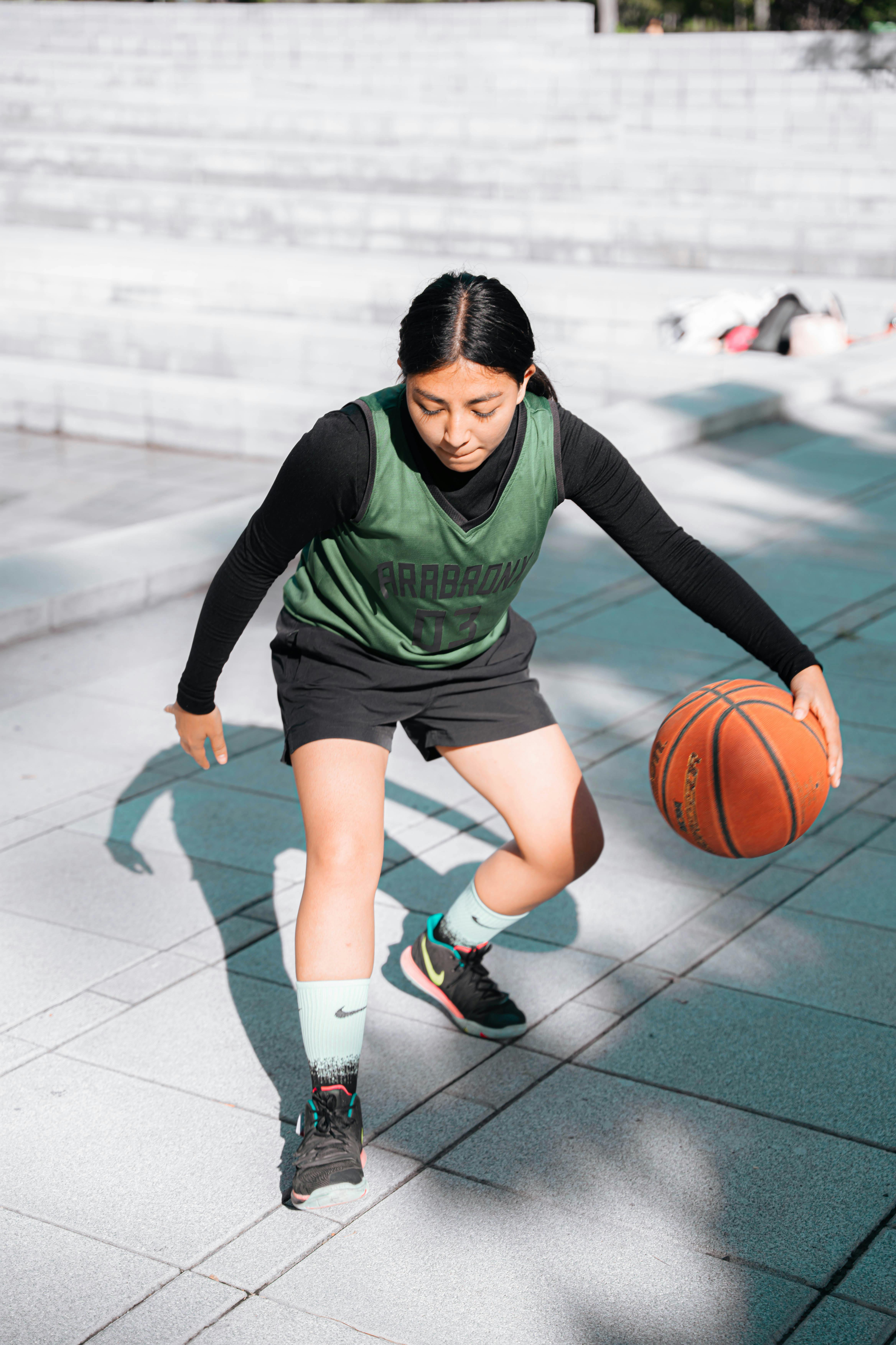 a woman playing basketball