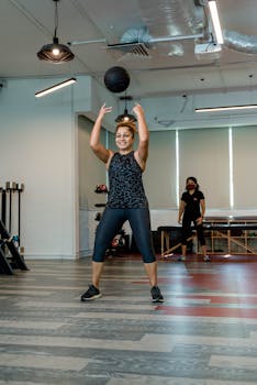 A woman in activewear exercises in a well-lit Singapore gym, promoting a healthy lifestyle.