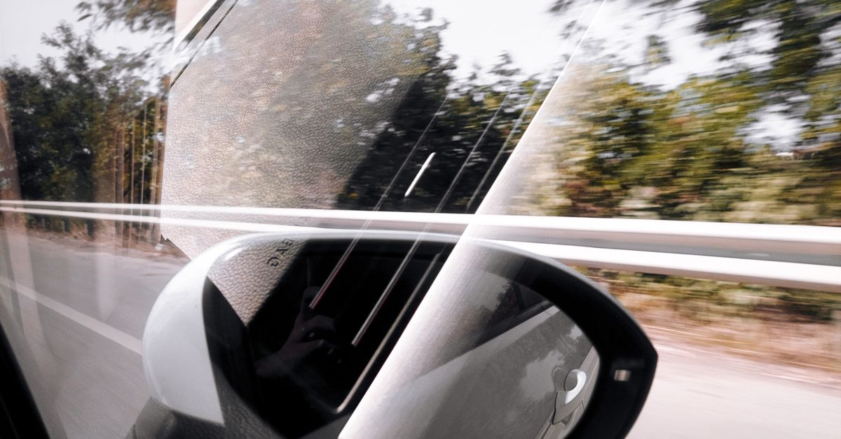 Reflection in Car Window · Free Stock Photo