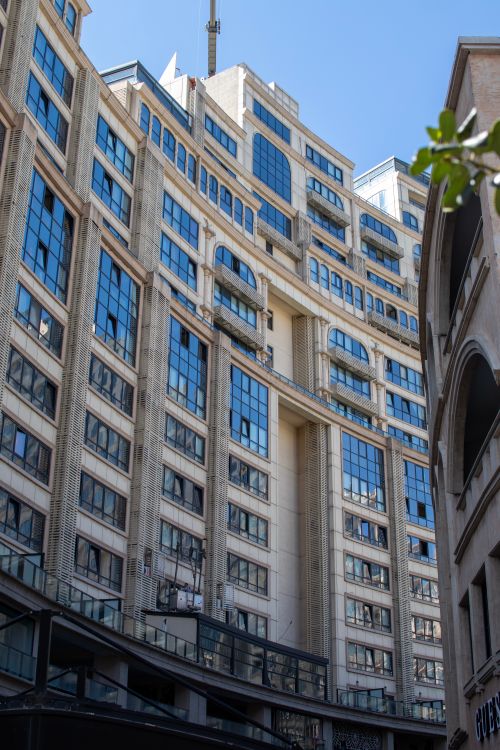 Free High-rise building facade in Istanbul with modern urban design and blue sky. Stock Photo