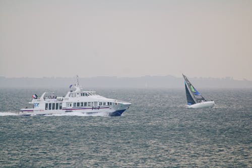 White and Black Boat on Sea