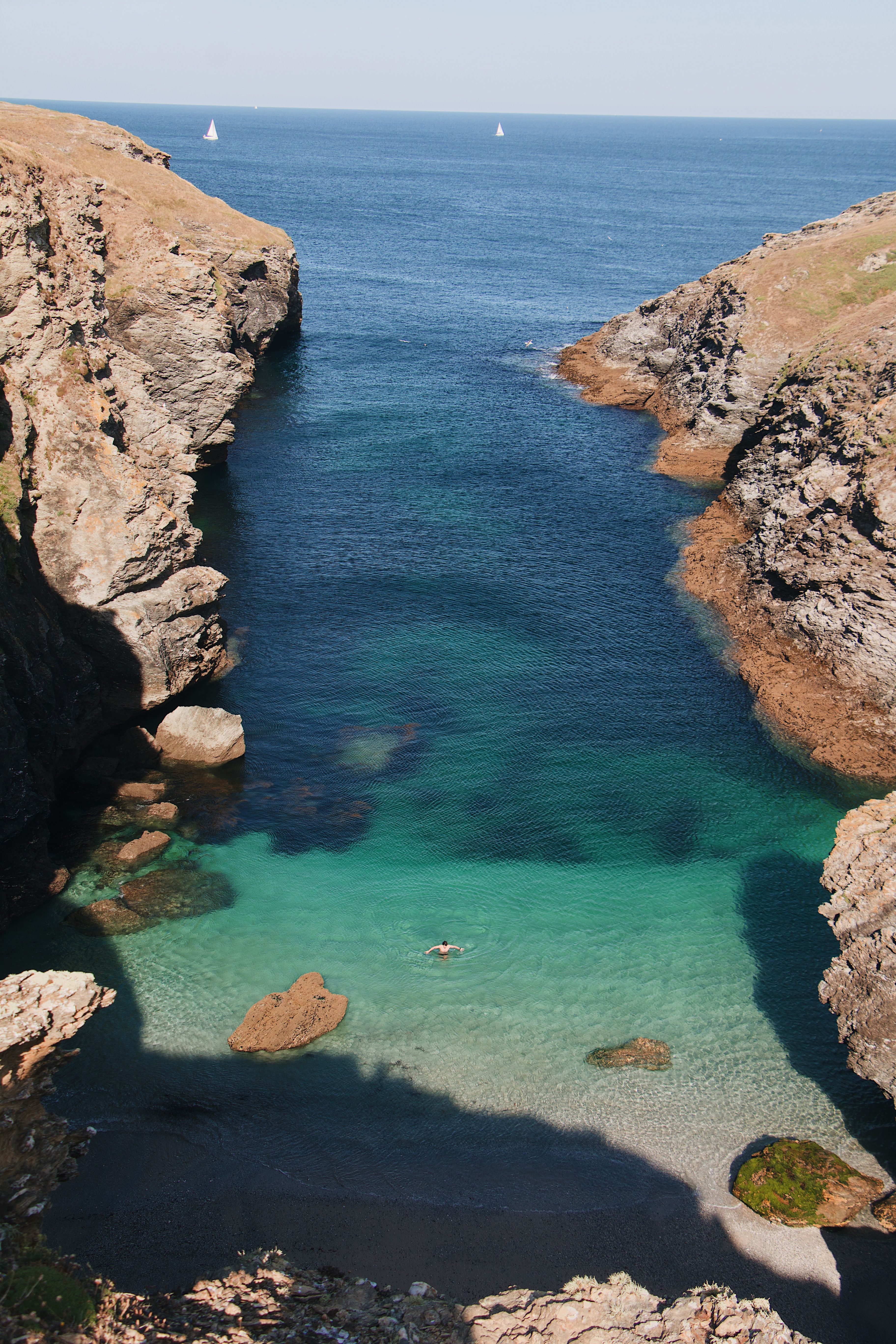 Explore the stunning turquoise waters of Bretagne's secluded cove, a perfect summer escape.