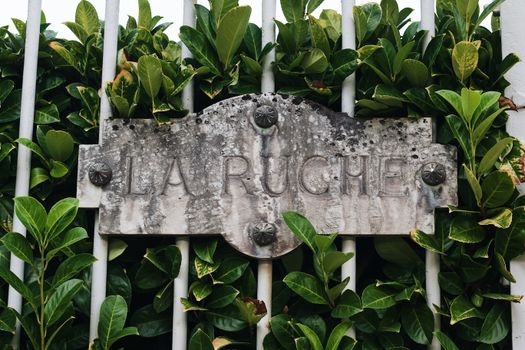 Signage on a Metal Railing