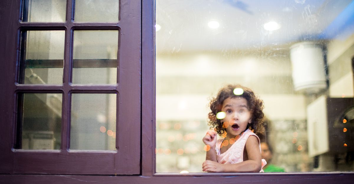 Girl Behind Glass Window · Free Stock Photo
