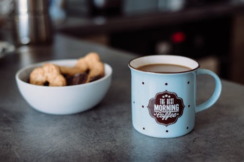 Ceramic Mug Beside White Ceramic Bowl