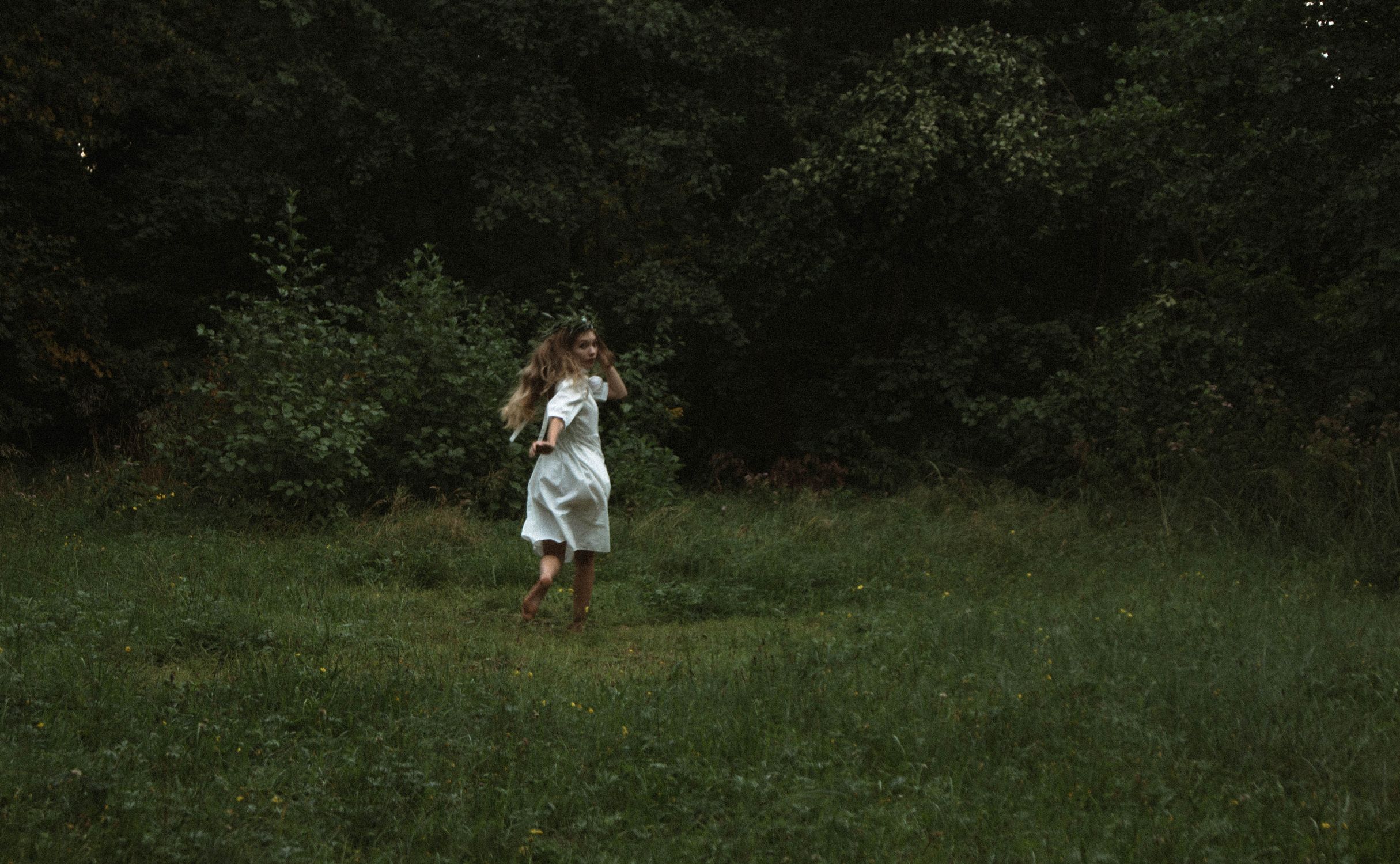 Blonde Woman in White Dress Running on Meadow in Forest · Free Stock Photo
