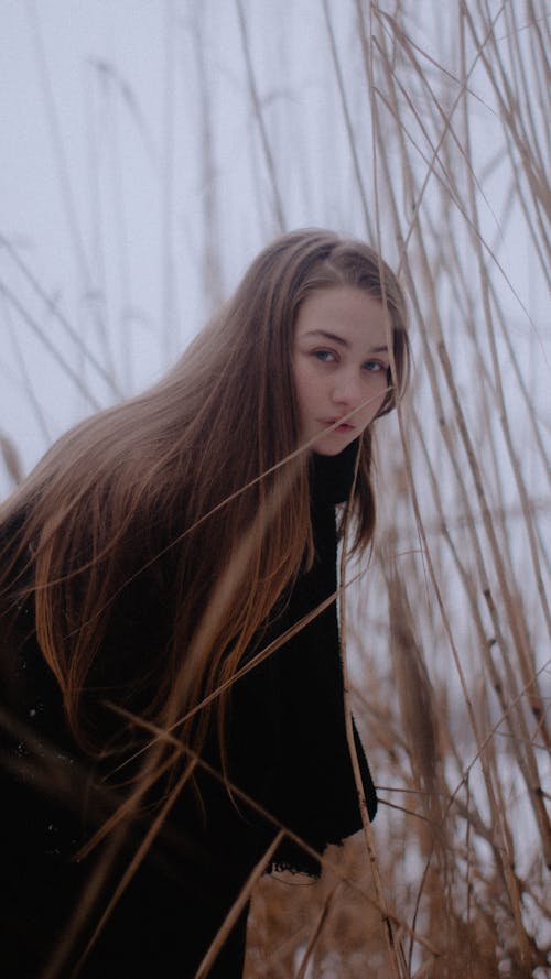 Woman in Black Coat Looking Over Her Shoulder