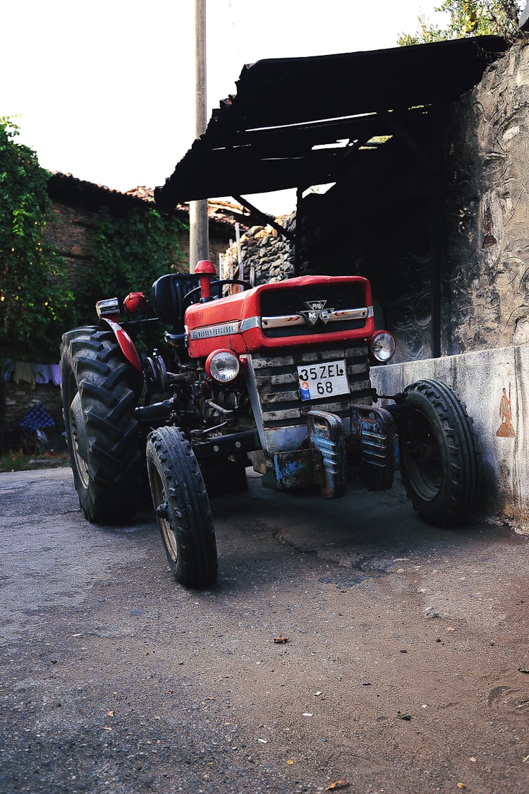 Massey Ferguson Farm Tractor Parked On Sidewalk