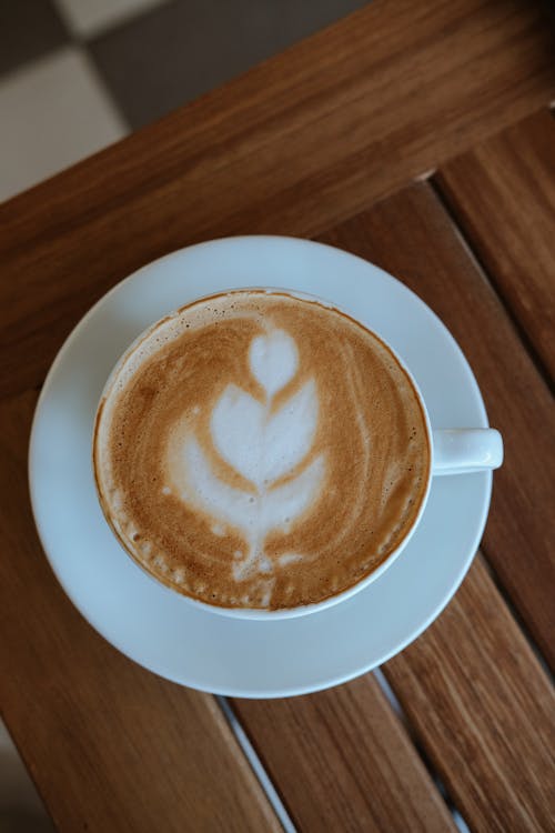 Close-Up Shot of Latte Art Coffee in White Ceramic Cup