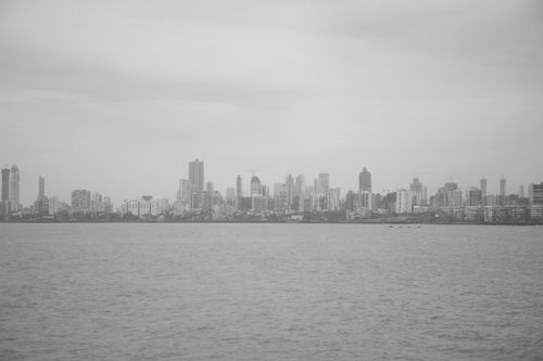 Free Grayscale view of Mumbai's iconic skyline from the sea, featuring skyscrapers. Stock Photo