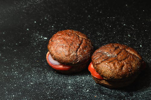 Free Close-Up Shot of Delicious Hamburgers on Black Surface Stock Photo